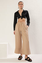 Trendyolmilla Vizon Modal Cep Detaylı Wide Leg/Geniş Paça Pileli Dokuma Pantolon TWOSS25PL00081 Palazzo