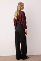 Trendyolmilla Siyah Diagonel Pileli Düğmeli Wide Leg/Geniş Paça Örme Pantolon TWOAW26PL00041