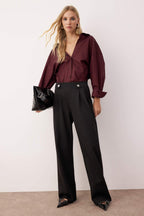 Trendyolmilla Siyah Diagonel Pileli Düğmeli Wide Leg/Geniş Paça Örme Pantolon TWOAW26PL00041