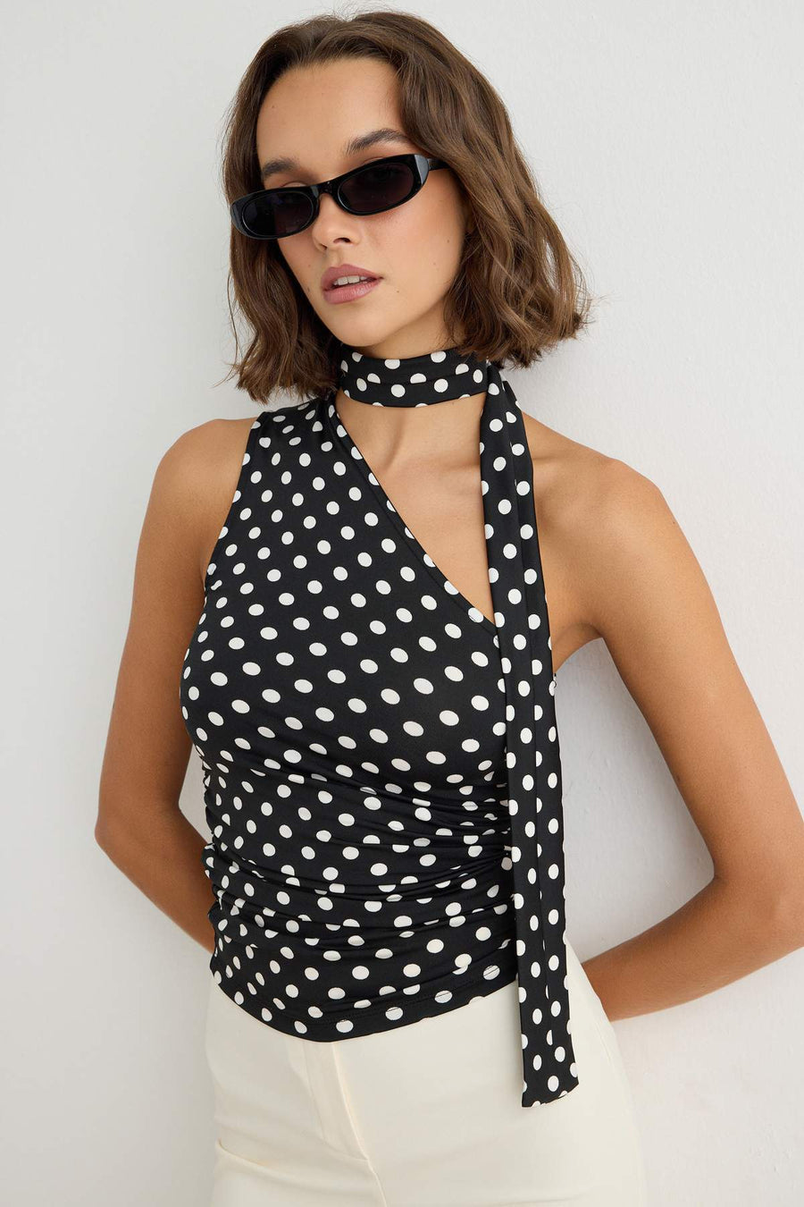 Black Ecru Polka Dot Fitted Asymmetric Shawl Collar Sleeveless Stretch Knit Blouse